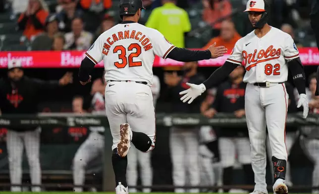 Baltimore Orioles' Christian Encarnacion-Strand (32) scores on an RBI double hit by Colton Cowser during the first inning in the second baseball game of a doubleheader against the Toronto Blue Jays, Wednesday, Sept. 23, 2026, in Baltimore. (AP Photo/Stephanie Scarbrough)