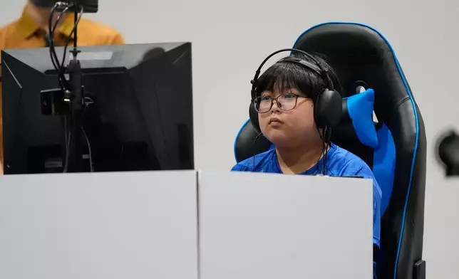 Japan's Yuki Kurihara competes against Kang Dong-shin of South Korea during the Puyo Puyo Champions esports final at the Asian Games in Nagoya, Japan, Saturday, Sept. 26, 2026. (AP Photo/Dita Alangkara)
