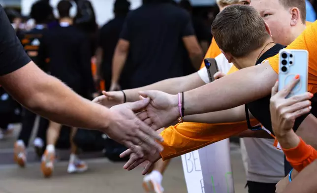 Fans greet players during the Vol Walk before an NCAA college football game between Tennessee and Texas, Saturday, Sept. 26, 2026, in Knoxville, Tenn. (AP Photo/Wade Payne)