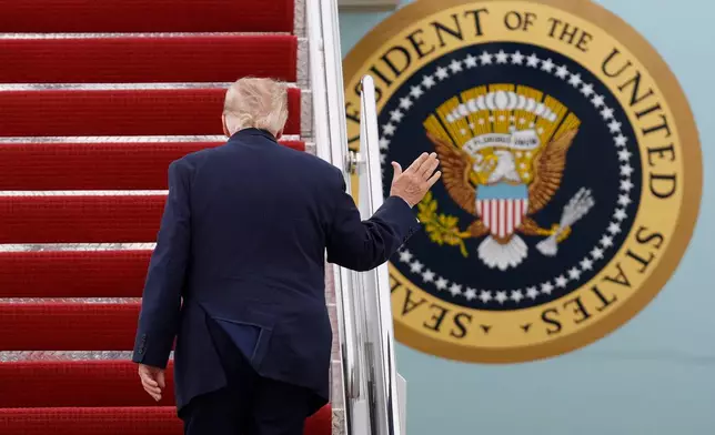 President Donald Trump walks up the stairs of Air Force One upon his departure at Joint Base Andrews, Md., Saturday, Sept. 26, 2026, en route to watch the Texas versus Tennessee NCAA college football game in Knoxville, Tenn. (AP Photo/Luis M. Alvarez)