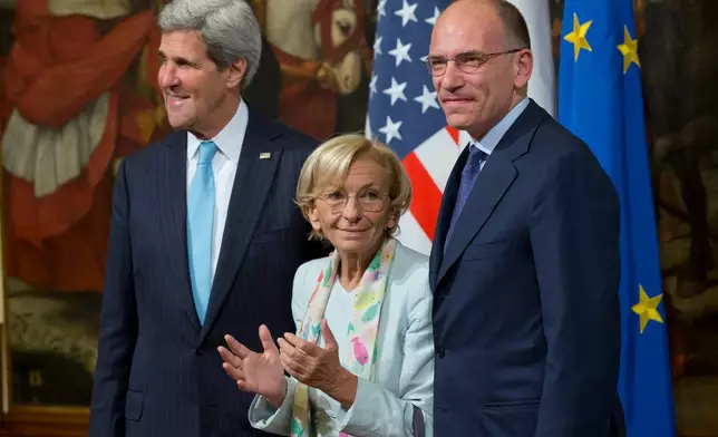 FILE - U.S. Secretary of State John Kerry, left, poses with Italian Foreign Minister Emma Bonino and Italian Premier Enrico Letta ,on the occasion of their meeting at Chigi Palace government office, in Rome, Wednesday, Oct. 23, 2013. (AP Photo/Andrew Medichini, File)