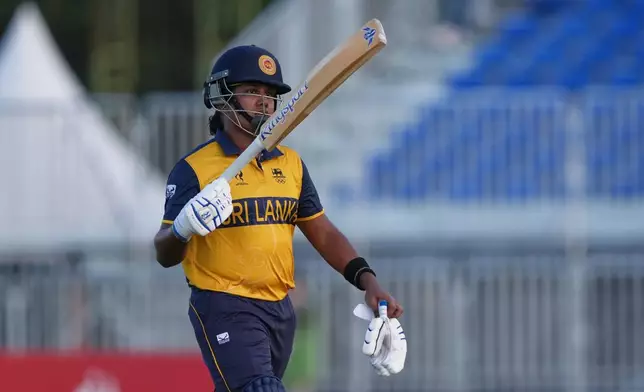Sri Lanka's CJK Athapaththu Mudiyanselage reacts after getting out by India's Deepti Sharma during the women's gold medal T20 cricket game between India and Sri Lanka at the Asian Games in Nisshin, Japan, Tuesday, Sept. 22, 2026. (AP Photo/Mark Baker)