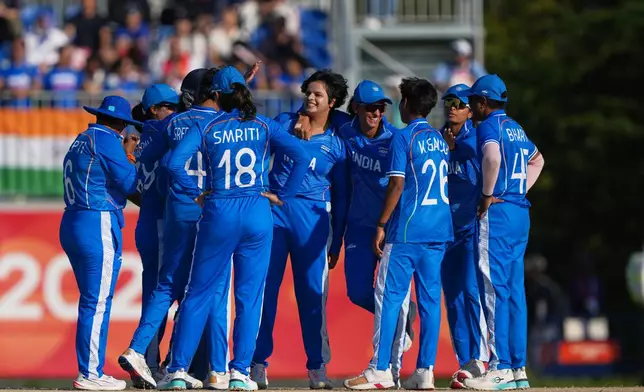 India's Shafali Verma celebrates with teammates the wicket of Sri Lanka's Imesha Dulani Witharana during the women's gold medal T20 cricket game between India and Sri Lanka at the Asian Games in Nisshin, Japan, Tuesday, Sept. 22, 2026. (AP Photo/Mark Baker)