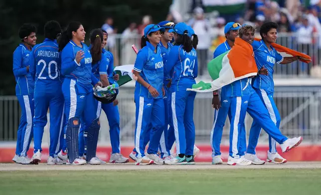 Indian players celebrate after winning the women's gold medal T20 cricket game between India and Sri Lanka at the Asian Games in Nisshin, Japan, Tuesday, Sept. 22, 2026. (AP Photo/Mark Baker)