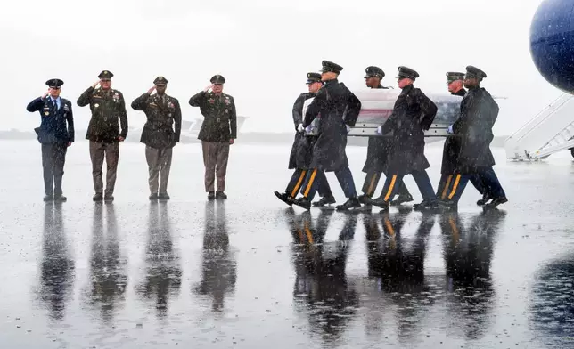 An Army carry team moves a transfer case containing the remains of Army Maj. Bianca C. Wilkerson, 37, of Norfolk, Va.. who died Sept. 18 as a result of a non-combat related incident while supporting operations in Doha, Qatar, Saturday, Sept. 26, 2026, at Dover Air Force Base, Del. (AP Photo/Cliff Owen)