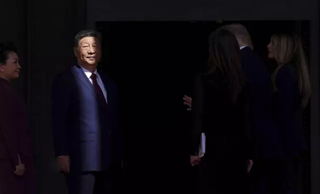China's President Xi Jinping is pictured alongside and his wife Peng Liyuan, left, upon arrival at the National Archives Museum, Friday, Sept. 25, 2026, in Washington. (AP Photo/Julia Demaree Nikhinson)
