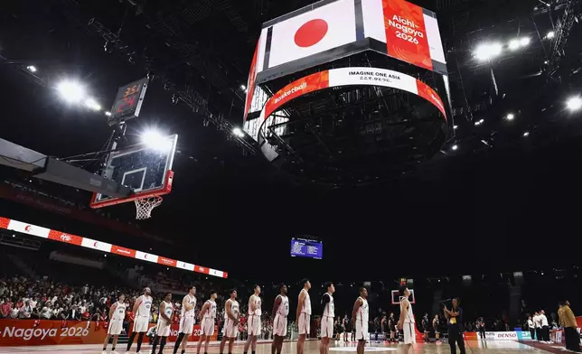 Members of the team Japan listen to their national anthem before their basketball game against Indonesia in the Asian Games in Nagoya, central Japan, on Sept. 10, 2026. (Takehito Nakamoto/Kyodo News via AP)