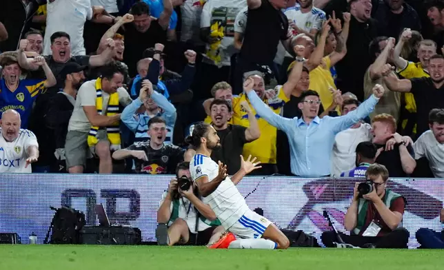 Leeds United's Dominic Calvert-Lewin celebrates scoring during the English Premier League soccer match between Leeds United and Newcastle United in Leeds, England, Monday Sept. 14, 2026. (Annabel Lee-Ellis/PA via AP)