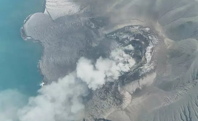 In this drone photo released by the Geological Agency (Badan Geologi) of Indonesia's Ministry of Energy and Mineral Resources, Mount Anak Krakatau spews volcanic smoke in Sunda Strait, Indonesia, Saturday, Sept. 5, 2026. (Badan Geologi via AP)