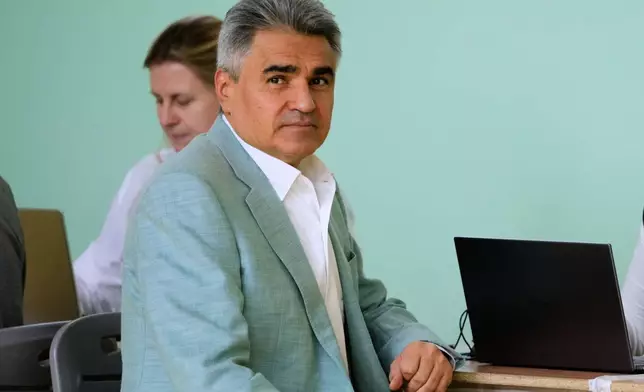 The New People's party leader Alexei Nechayev waits to receive a ballot to vote in the parliamentary election in Moscow, Saturday, Sept. 19, 2026. (AP Photo/Pavel Bednyakov) CAPTION CORRECTION: Corrects spelling of first name from Alexey to Alexei