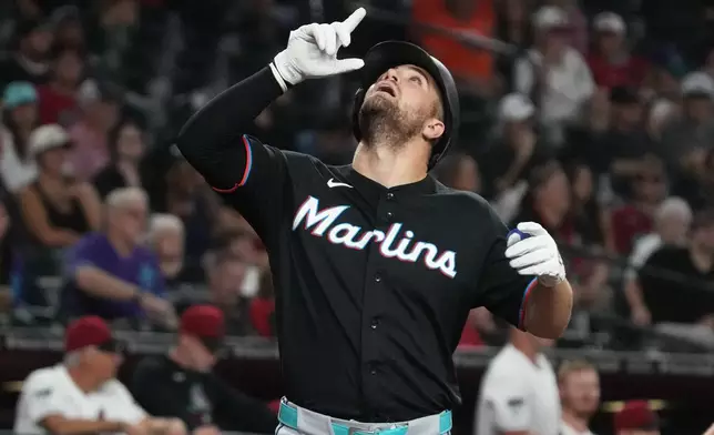 Miami Marlins' Jakob Marsee looks skyward after hitting a solo home run against the Arizona Diamondbacks in the fourth inning of a baseball game, Monday, Sept 14, 2026, in Phoenix. (AP Photo/Rick Scuteri)
