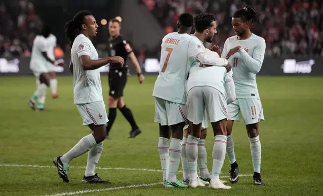 French players stand around Kylian Mbappe after he scored and injured himself during the UEFA Nations League soccer match between Turkey and France in Izmit, Turkey, Friday, Sept. 25, 2026. (AP Photo/Khalil Hamra)