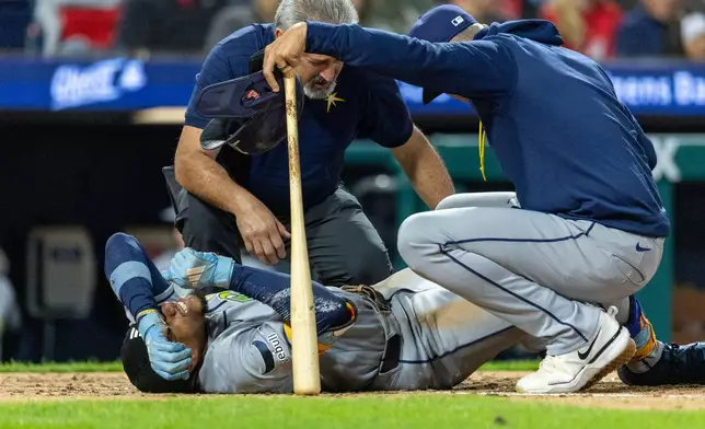 Tampa Bay Rays' Chandler Simpson reacts on the ground after he fouled a ball off his leg in the sixth inning of a baseball game against the Philadelphia Phillies, Friday, Sept. 25, 2026, in Philadelphia. (AP Photo/Laurence Kesterson)