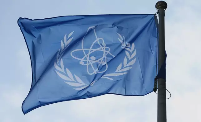 FILE - The International Atomic Energy Agency (IAEA) flag flies during a special session of an IAEA Board of Governors meeting in Vienna, Austria, March 2, 2026. (AP Photo/Heinz-Peter Bader, File)