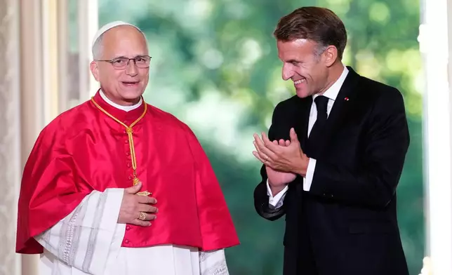 Pope Leo XIV, left, and French President Emmanuel Macron, attend a joint statement at the Elysee Palace, Friday, Sept. 25, 2026. (AP Photo/Teresa Suarez, Pool)