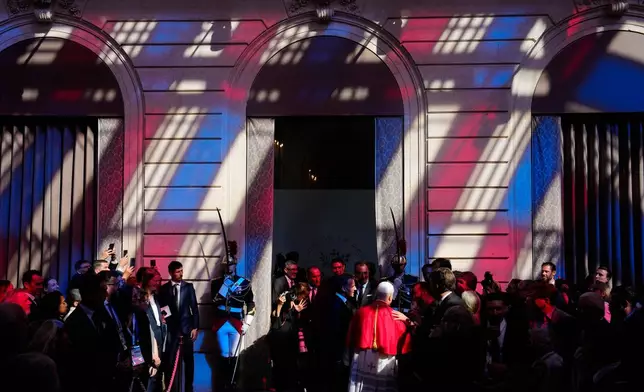 Pope Leo XIV, center right, and French President Emmanuel Macron, leave after a joint statement at the Elysee Palace, Friday, Sept. 25, 2026. (AP Photo/Teresa Suarez, Pool)