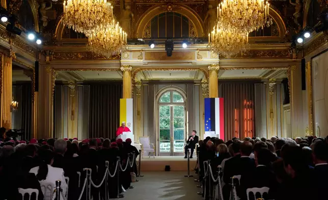 Pope Leo XIV, left, speaks during a joint statement with French President Emmanuel Macron at the Elysee Palace, Friday, Sept. 25, 2026. (AP Photo/Teresa Suarez, Pool)