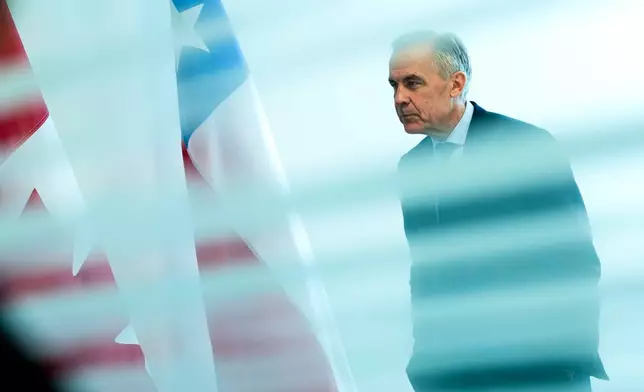 Canada Prime Minister Mark Carney is seen from behind a glass pane as he waits to meet with President of Chile José Antonio Kast, not shown, on the sidelines of the United Nations General Assembly (UNGA) at the UN headquarters on Tuesday, Sept. 22, 2026. (Justin Tang/The Canadian Press via AP)