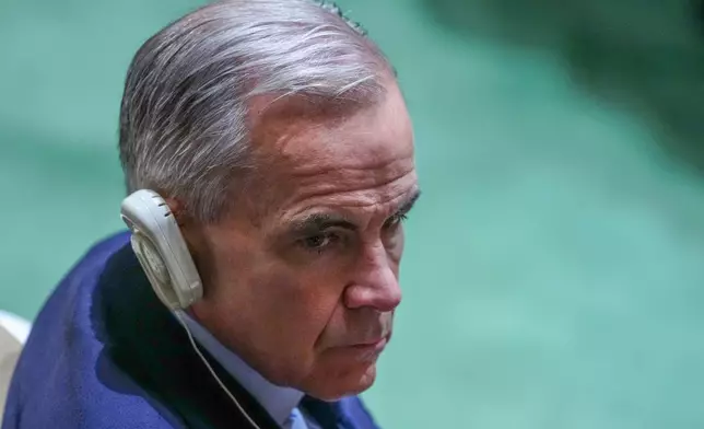 Canada's Prime Minister Mark Carney waits to listen to President Donald Trump speak to the United Nations General Assembly, Tuesday, Sept. 22, 2026, at the UN headquarters. (AP Photo/Julia Demaree Nikhinson)