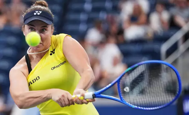 Linda Noskova, of the Czech Republic, returns the ball to Katie Volynets, of the United States, during the first round of the U.S. Open tennis championships, Monday, Aug. 31, 2026, in New York. (AP Photo/Kirsty Wigglesworth)