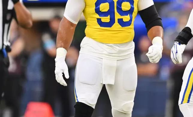 Los Angeles Rams defensive end Aaron Donald (99) smiles during the first half of an NFL football game against the New York Giants in Inglewood, Calif., Monday, Sept. 21, 2026. (AP Photo/Katie Chin)