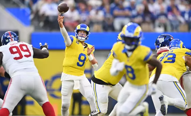 Los Angeles Rams quarterback Matthew Stafford (9) throws a pass during the first half of an NFL football game against the New York Giants in Inglewood, Calif., Monday, Sept. 21, 2026. (AP Photo/Katie Chin)