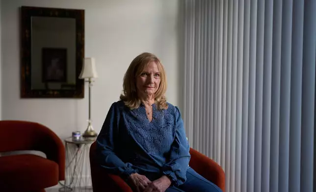 Debra Fox, who had $58,000 stolen from her in a romance scam, is photographed at her home, Tuesday, May 12, 2026, in Arvada, Colo. (AP Photo/David Goldman)