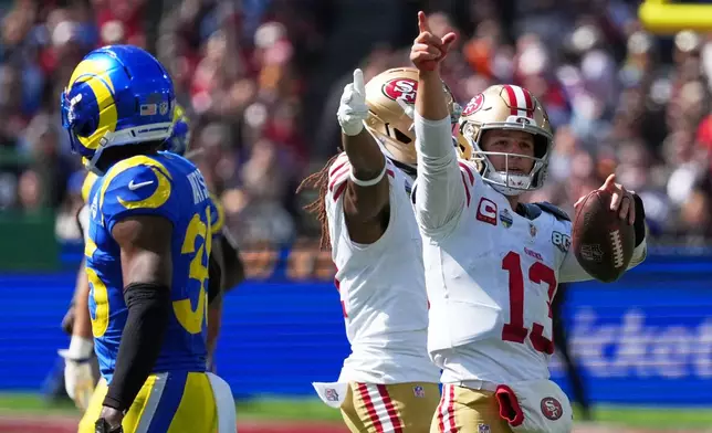 San Francisco 49ers quarterback Brock Purdy celebrates after a runs against the Los Angeles Rams during the second half of an NFL football game, Friday, Sept. 11, 2026, in Melbourne, Australia. (AP Photo/Asanka Brendon Ratnayake)