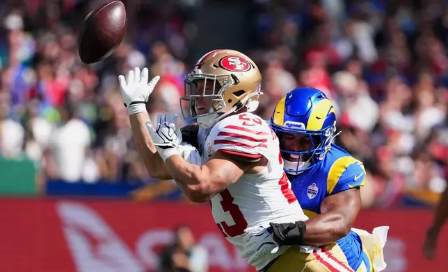 Los Angeles Rams linebacker Omar Speights breaks up a pass intended for San Francisco 49ers running back Christian McCaffrey during the first half of an NFL football game, Friday, Sept. 11, 2026, in Melbourne, Australia. (AP Photo/Scott Barbour)
