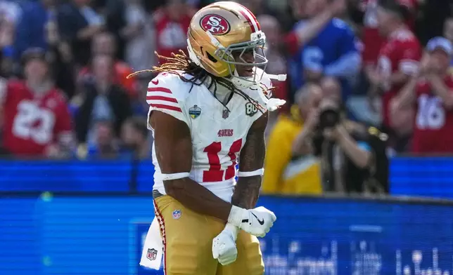 San Francisco 49ers wide receiver Demarcus Robinson celebrates after scoring against the Los Angeles Rams during the first half of an NFL football game, Friday, Sept. 11, 2026, in Melbourne, Australia. (AP Photo/Scott Barbour)