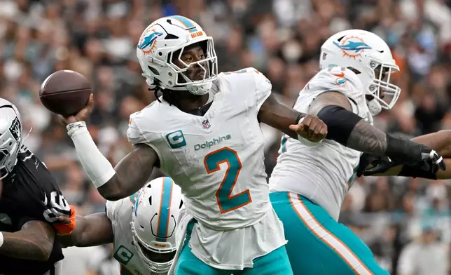 Miami Dolphins quarterback Malik Willis (2) throws a pass during the second half of an NFL football game against the Las Vegas Raiders, Sunday, Sept. 13, 2026, in Las Vegas. (AP Photo/David Becker)