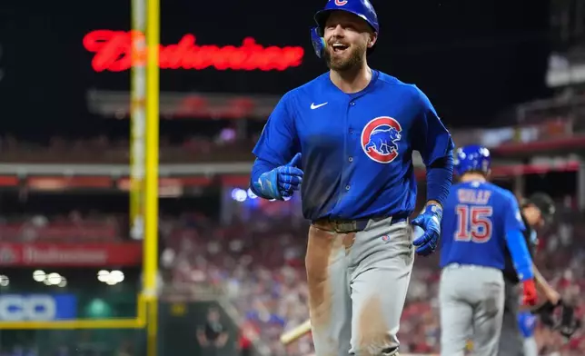 Chicago Cubs' Michael Busch smiles after hitting a solo home run during the sixth inning of a baseball game against the Cincinnati Reds, Saturday, Sept. 19, 2026, in Cincinnati. (AP Photo/Kareem Elgazzar)