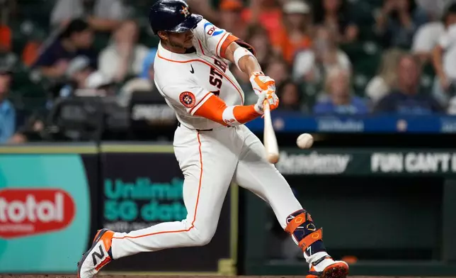 Houston Astros shortstop Jeremy Peña hits a home run during the third inning of a baseball game against the Kansas City Royals in Houston, Tuesday, Sept. 15, 2026. (AP Photo/Ashley Landis)