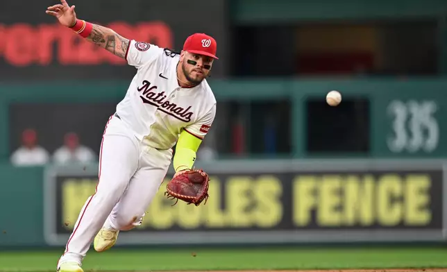 Washington Nationals first baseman Andrés Chaparro fields a ground ball to put out Miami Marlins' Kyle Stowers during the second inning of a baseball game, Monday, Aug. 31, 2026, in Washington. (AP Photo/John McDonnell)
