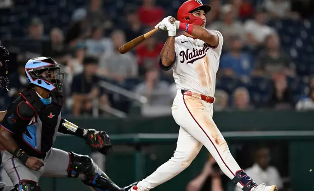 Washington Nationals' Daylen Lile watches his two run home run go over the right field fence during the seventh inning of a baseball game against the Miami Marlins, Monday, Aug. 31, 2026, in Washington. (AP Photo/John McDonnell)