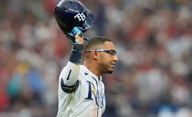 Tampa Bay Rays' Richie Palacios celebrates his walkoff single off Boston Red Sox pitcher Garrett Whitlock during the ninth inning of a baseball game Saturday, Sept. 19, 2026, in St. Petersburg, Fla. (AP Photo/Chris O'Meara)