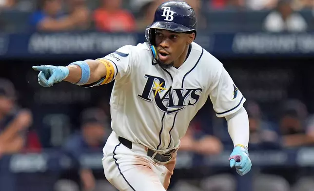 Tampa Bay Rays' Chandler Simpson celebrates after his single off Boston Red Sox pitcher Garrett Whitlock during the ninth inning of a baseball game Saturday, Sept. 19, 2026, in St. Petersburg, Fla. (AP Photo/Chris O'Meara)