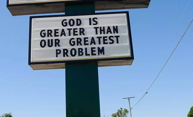 FILE — A positive message is displayed on the sign for Locust Grove Free Will Baptist Church in Locust Grove, Okla. Tuesday, Sept. 16, 2008. (AP Photo/Brandi Simons)