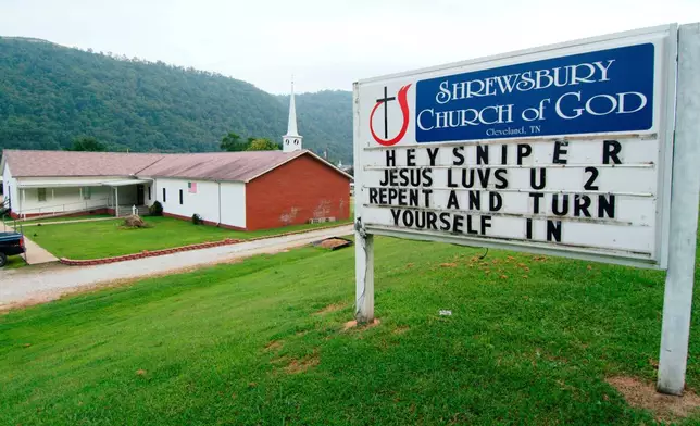 FILE — A sign in front of the Shrewsbury Church of God in Shrewsbury, W.Va., shown, Aug. 22, 2003, includes a message concerning three fatal shootings in the Charleston, W.Va.-area. (AP Photo/Bob Bird, File)