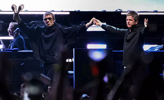 FILE - Liam Gallagher, left, and Noel Gallagher of Oasis perform on Sunday, Aug. 31, 2025, in East Rutherford, N.J. (Photo by Evan Agostini/Invision/AP, File)