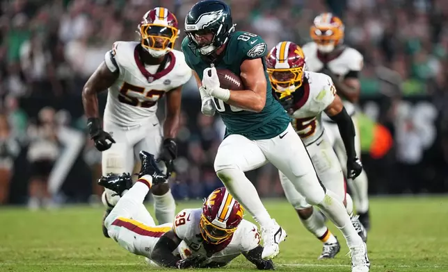 Philadelphia Eagles tight end Dallas Goedert (88) iuns for a touchdown against the Washington Commanders during the second half of an NFL football game, Sunday, Sept. 13, 2026, in Philadelphia. (AP Photo/Matt Rourke)