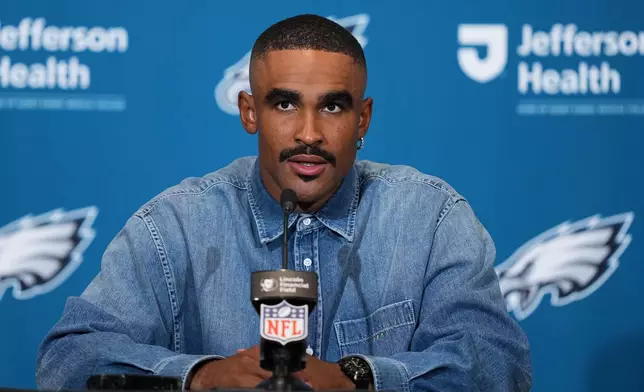 Philadelphia Eagles quarterback Jalen Hurts talks to the media following an NFL football game against the Washington Commanders, Sunday, Sept. 13, 2026, in Philadelphia. (AP Photo/Matt Rourke)