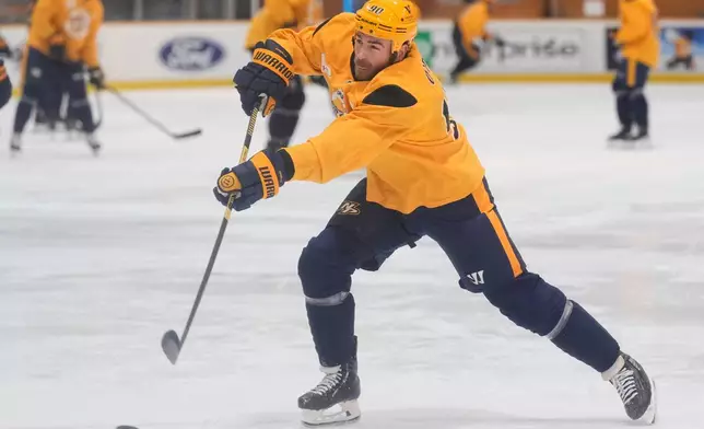 Nashville Predators center Ryan O'Reilly (90) shoots the puck during NHL hockey training camp Thursday, Sept. 17, 2026, in Nashville, Tenn. (AP Photo/George Walker IV)