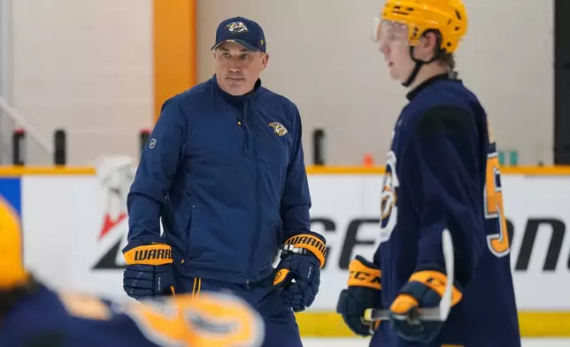 Nashville Predators head coach Andrew Brunette watches his players during NHL hockey training camp Thursday, Sept. 17, 2026, in Nashville, Tenn. (AP Photo/George Walker IV)