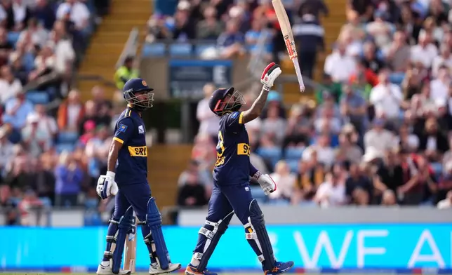 Sri Lanka's Kusal Mendis, right, leaves the pitch after being caught out by England's Tom Banton during the second one day international cricket match between England and Sri Lanka in Leeds, England, Thursday Sept. 24, 2026. (Mike Egerton/PA via AP)