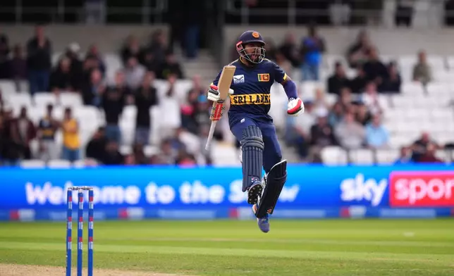 Sri Lanka's Kusal Mendis celebrates a century during the second one day international cricket match between England and Sri Lanka in Leeds, England, Thursday Sept. 24, 2026. (Mike Egerton/PA via AP)