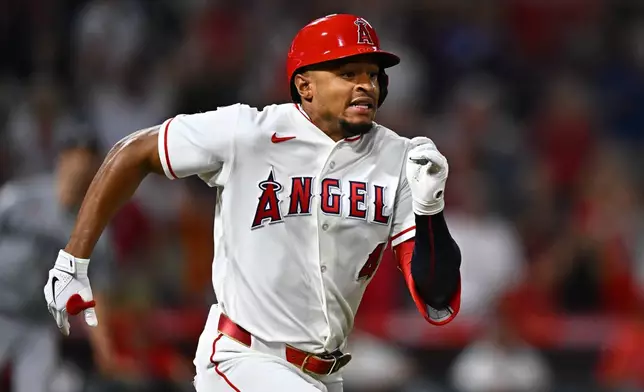 Los Angeles Angels' Christian Moore runs after hitting a walk-off single during the 11th inning of a baseball game against the Minnesota Twins, Saturday, Sept. 19, 2026, in Anaheim, Calif. (AP Photo/William Liang)