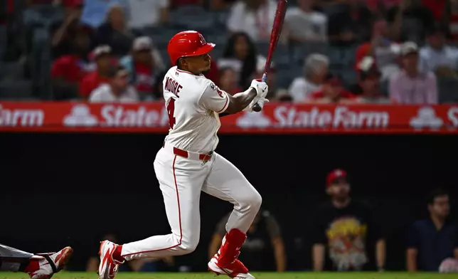 Los Angeles Angels' Christian Moore hits a walk off single during the 11th inning of a baseball game against the Minnesota Twins, Saturday, Sept. 19, 2026, in Anaheim, Calif. (AP Photo/William Liang)
