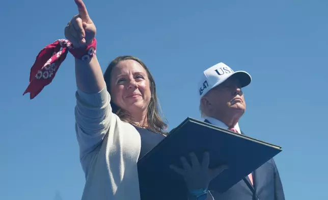 Paige Crowther Charbonnea, left, after President Donald Trump posthumously awarded the Presidential Medal of Freedom to her brother, 9/11 hero Welles Crowther, during a Steel Across America event with the Tunnel to Towers Foundation on the Ellipse, Tuesday, Sept. 8, 2026, in Washington. (AP Photo/Jacquelyn Martin)