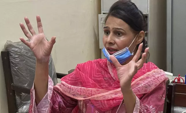 Nurse Razia Noreen, who risked her life to save a newborn during a fire at the Pakistan Institute of Medical Sciences, speaks during an interview in Islamabad, Tuesday, Sept. 1, 2026. (AP Photo/M.Yousaf)